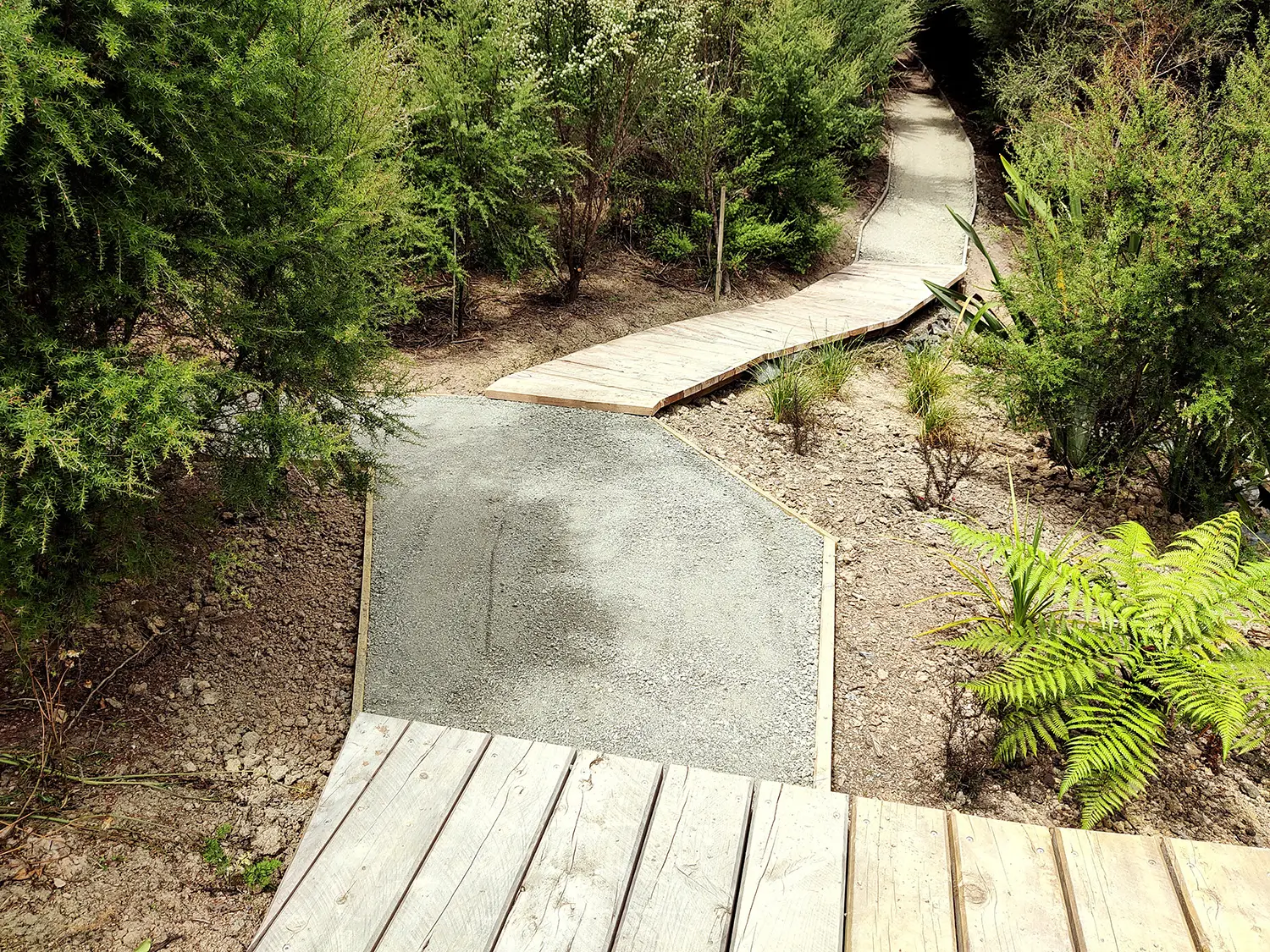 Paths and landscaping surrounding the bridge