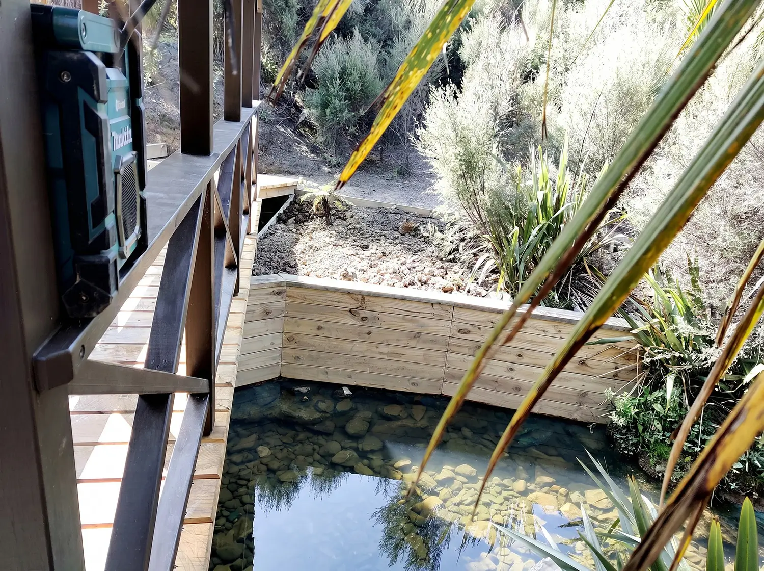 Retaining planter boxes alongside the bridge