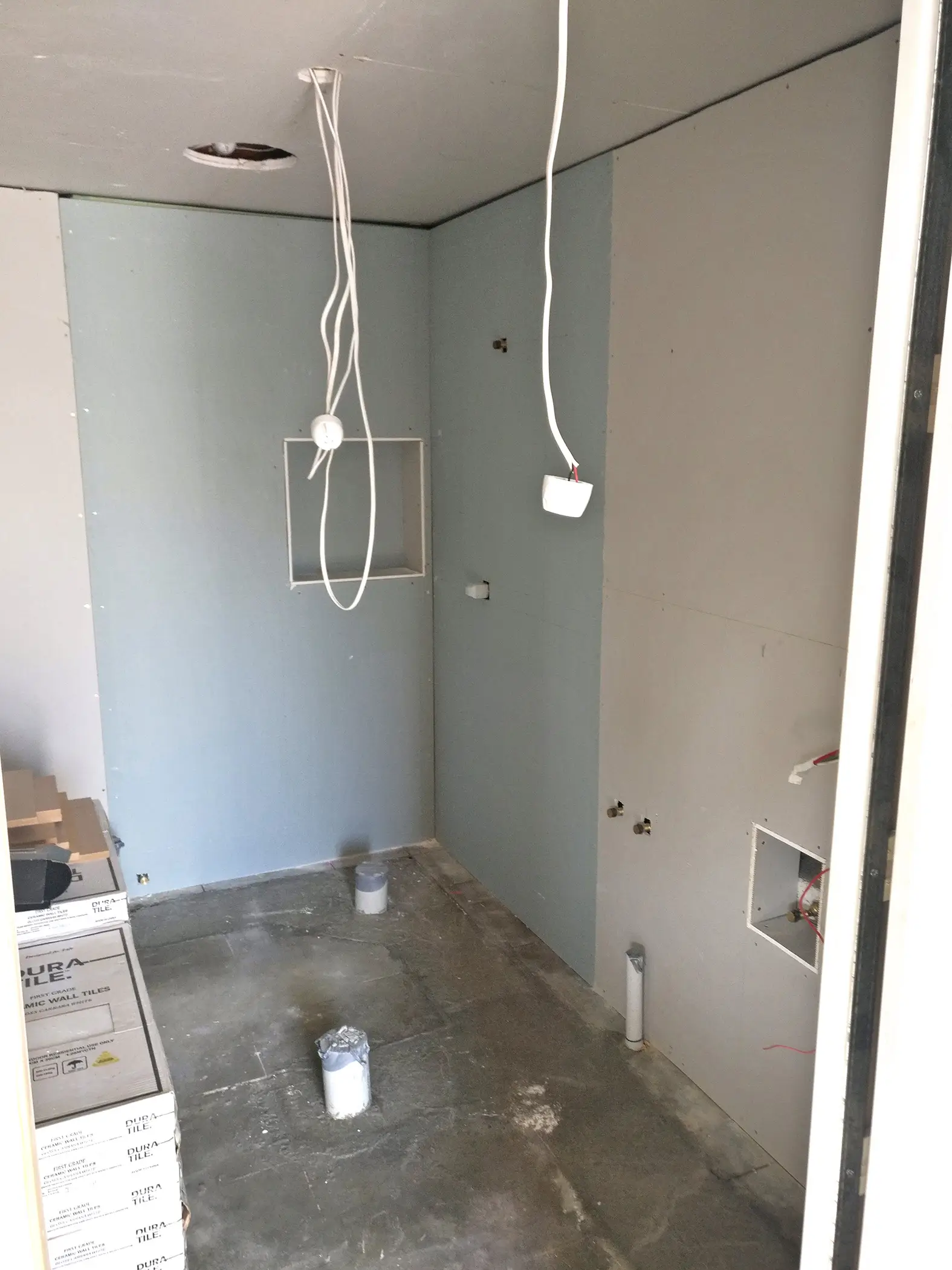 Bathroom mid-build with gib and wiring in