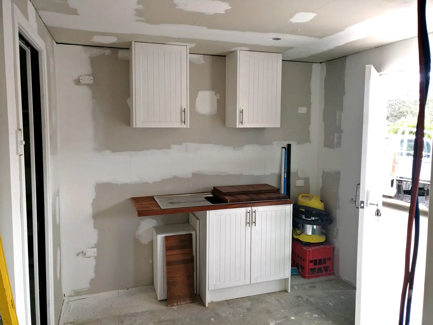 Kitchenette cabinetry going in