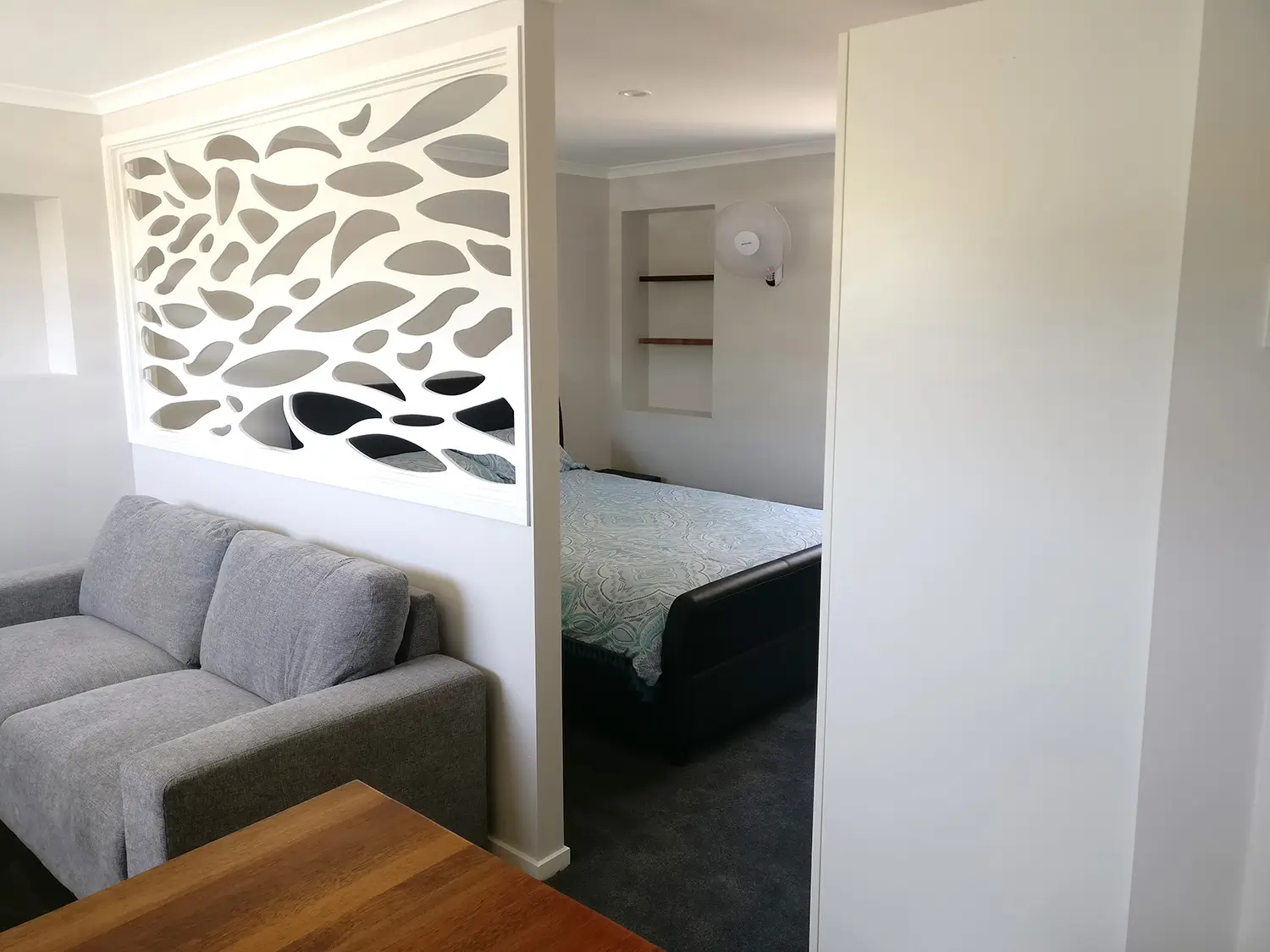 The finished laser-cut screen between lounge and bedroom