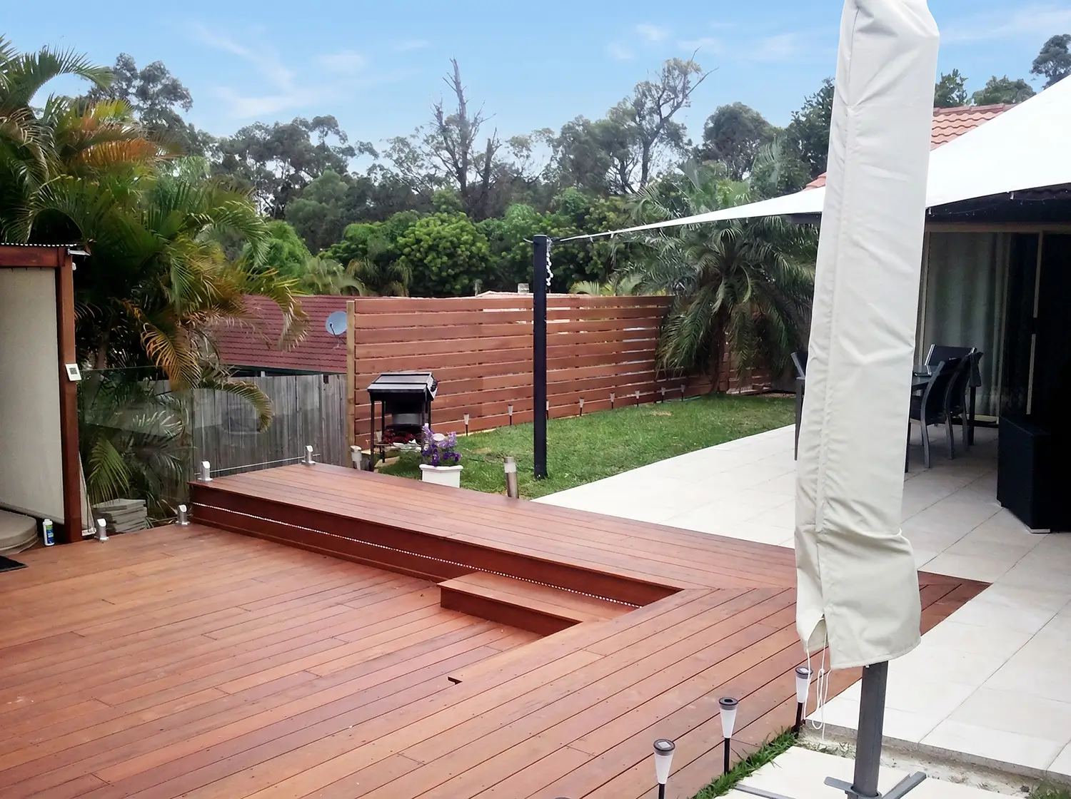 Finished kwila decking meeting the new paving