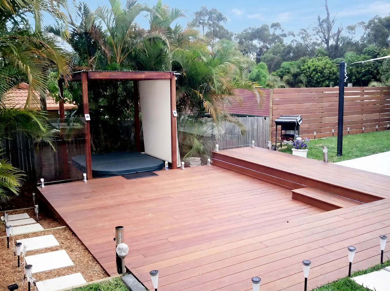 Spa nook with kwila decking and privacy screen fencing